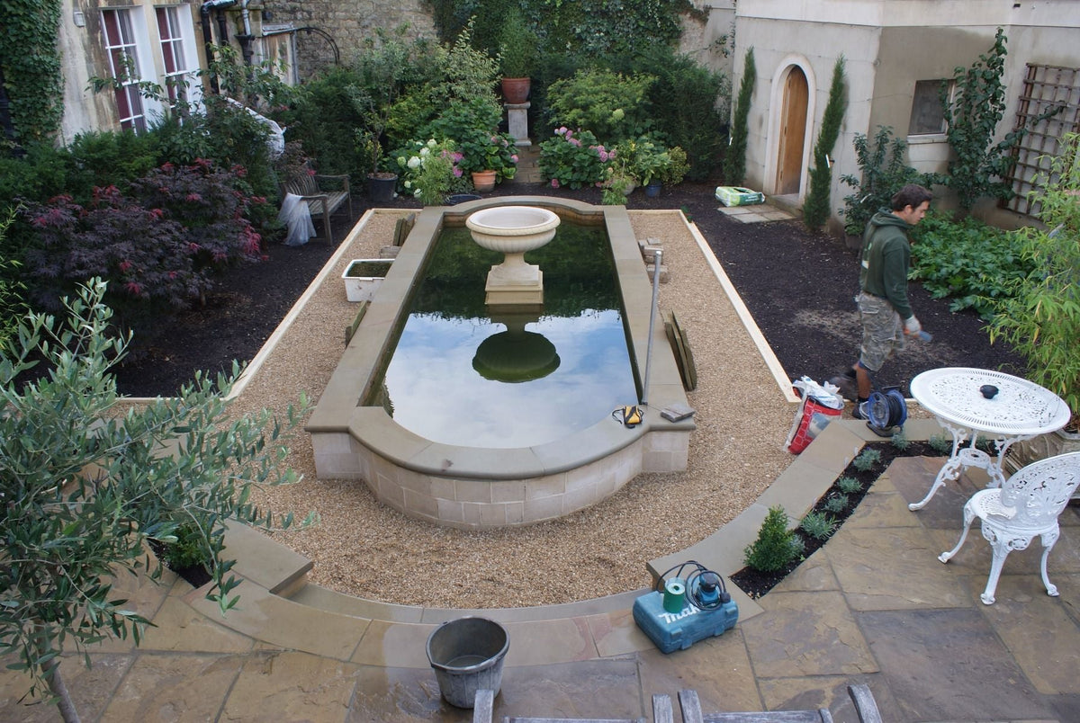 Box welded pond liner in a formal pond